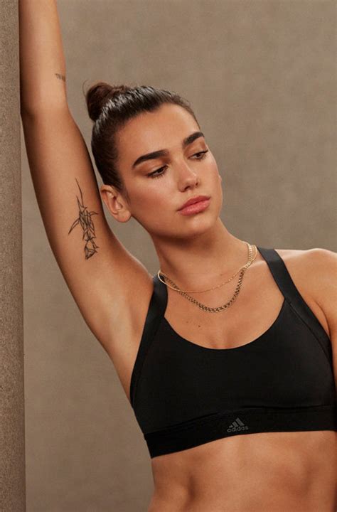 tatuajes dua lipa|Dua Lipa’s 13 Tattoos & Their Meanings